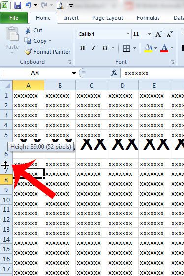 click and drag the bottom border of the row number