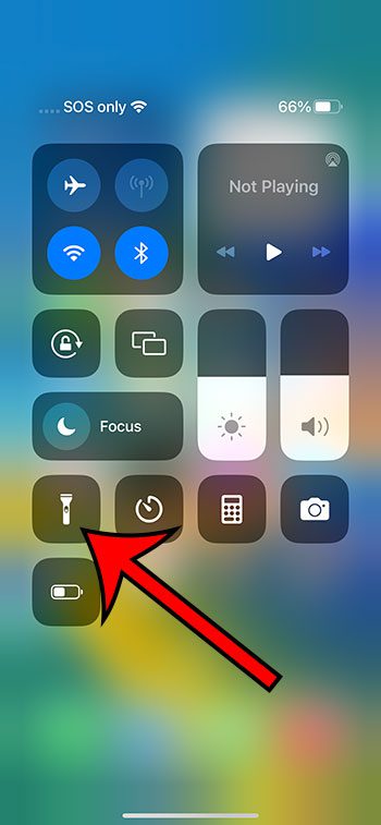 tap and hold on the flashlight button