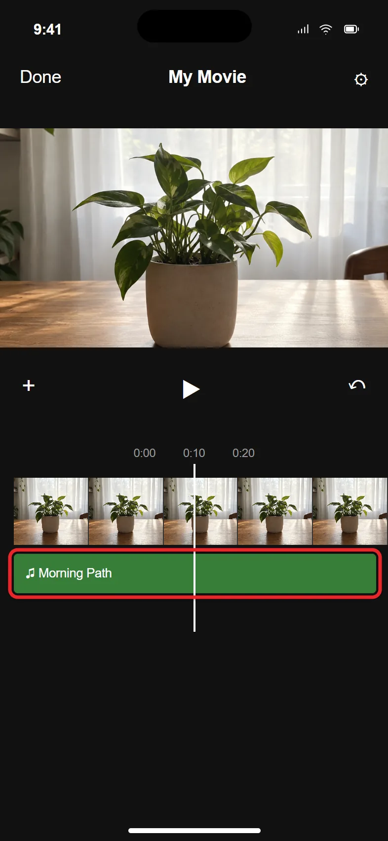 How to Add Music to a Video on iPhone 2 iMovie timeline with a green music track under the video