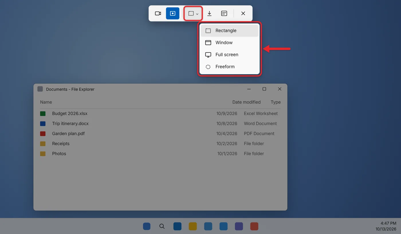 What Is a Screenshot and How Do I Take One? 1 Snipping Tool capture bar at the top of a dimmed Windows 11 screen with the snipping mode options